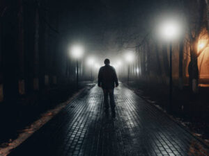 image-sad-man-alone-walking-along-the-alley-in-night-foggy-park-back-view